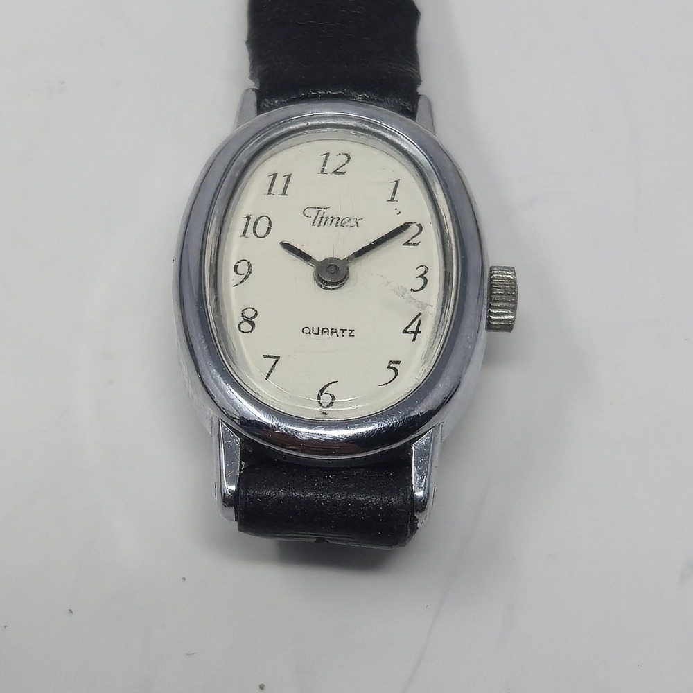 Vintage Timex Oval Watch Womens Silver Tone White Dial Black Leather Strap 377